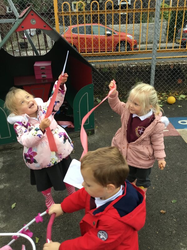 Image of Nursery having fun in the windy weather